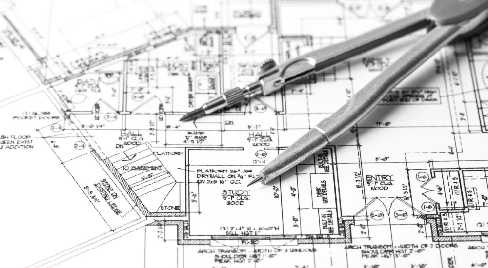 Architectural blueprints with drafting tools